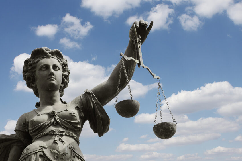 Statue of Justice holding scales
